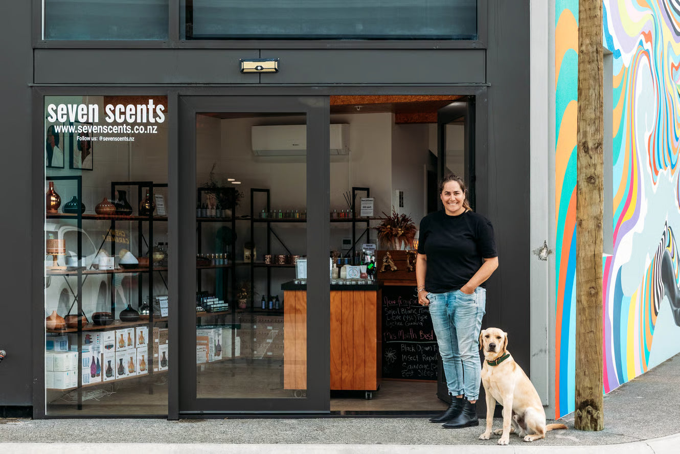 Shannon outside the Seven Scents maker studio in Lyall Bay, Wellington with Chase Forbes the dog