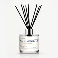 Aloe Vera & White Lily Reed Diffuser by Seven Scents - 200ml clear glass bottle with black reeds and a silver collar