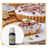 Banoffee pie with a bottle of Seven Scents Banoffee Pie fragrance oil on a wooden table.