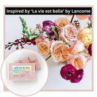 Bellas Love Wax Melts packaging with a bouquet of flowers inspired by 'La vie est belle' by Lancome.