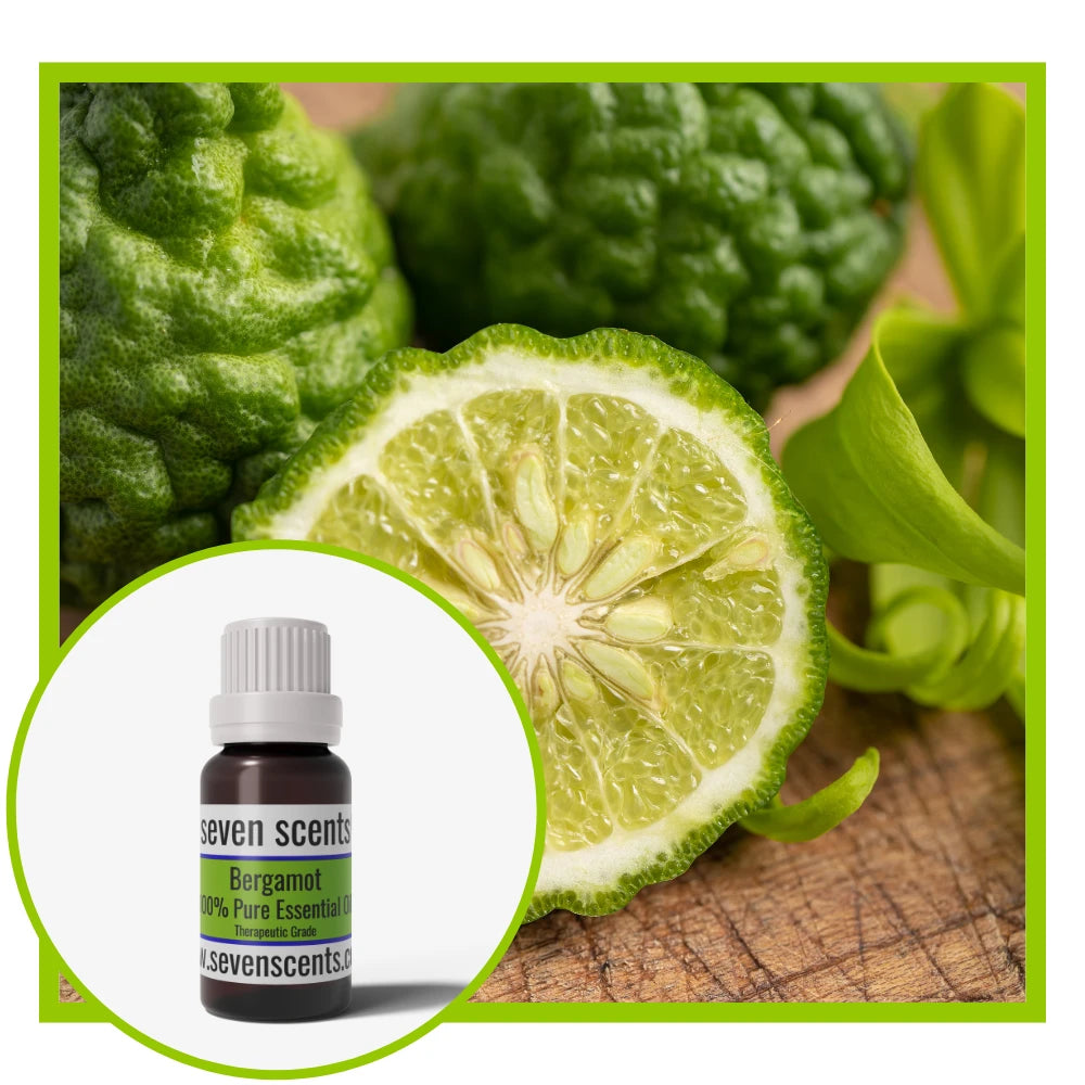 Bergamot essential oil by Seven Scents with bergamot fruit and a cut section