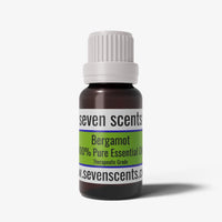 Bergamot essential oil bottle by Seven Scents with a white cap on a white background