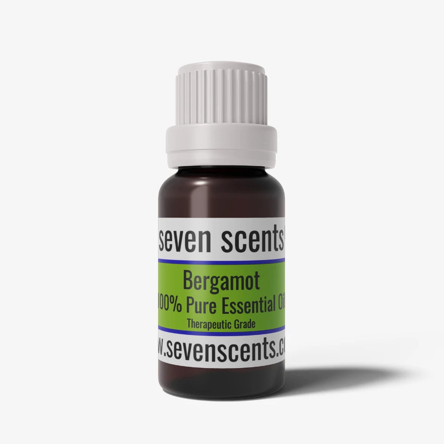 Bergamot essential oil bottle by Seven Scents with a white cap on a white background