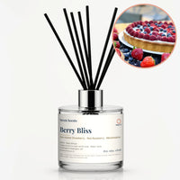 Berry Bliss Reed Diffuser by Seven Scents - glass bottle with a raspberry and blueberry tart and strawberries