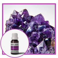 Black amethyst fragrance oil with an amethyst crystal cluster