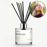 Breathe Easy Reed Diffuser by Seven Scents - glass bottle with a woman in a beanie with her eyes closed outdoors