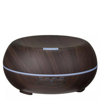 Charli essential oil diffuser in dark wood-grain, front view - Seven Scents