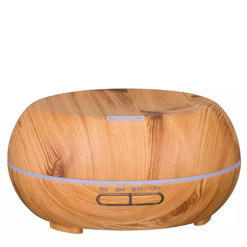Charli essential oil diffuser in light wood-grain, front view - Seven Scents
