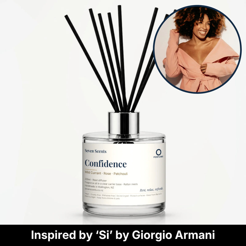 Confidence Reed Diffuser by Seven Scents - glass bottle with a smiling woman in a peach robe