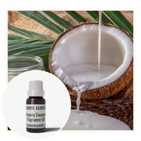 Creamy coconut fragrance oil with coconut cream being poured into a fresh coconut