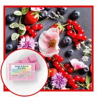 Daisies & Berries wax melts packaging with strawberries, blueberries, and flowers on a dark surface