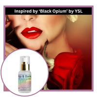 Woman with red lipstick and a bottle of Edgy and Daring perfume inspired by 'Black Opium'.