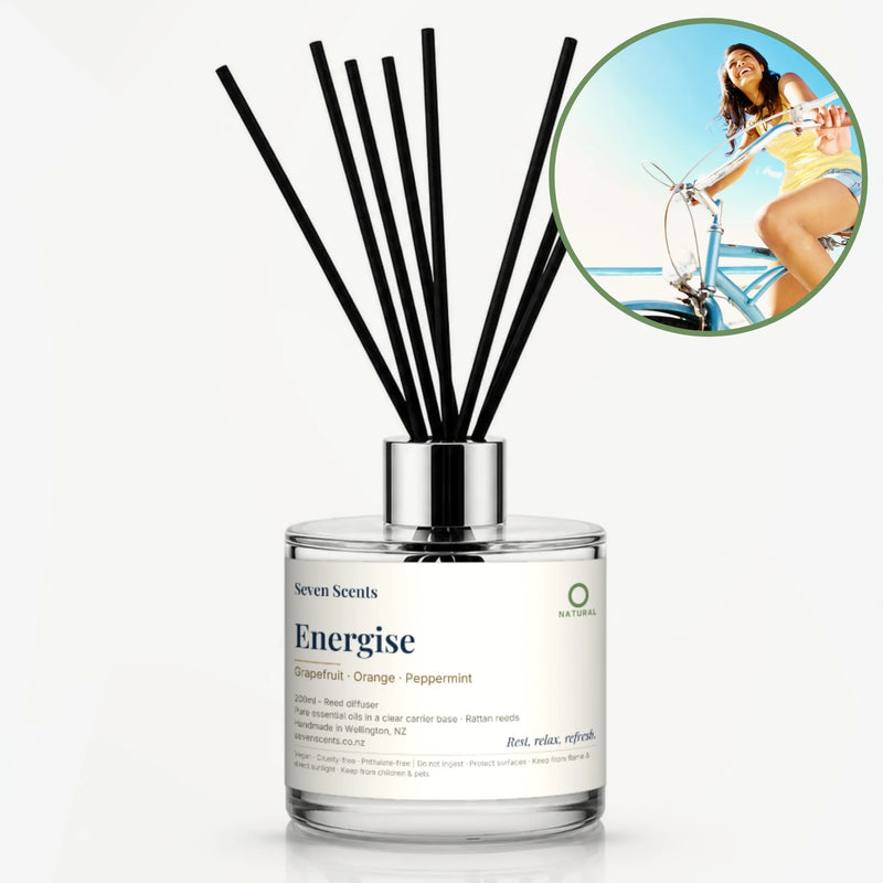 Energise Reed Diffuser by Seven Scents - glass bottle with a woman riding a bike in the sun