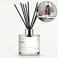 Focus Reed Diffuser by Seven Scents - glass bottle with a young woman studying with open books