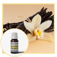 Vanilla flower and vanilla beans with a bottle of Seven Scents French Vanilla fragrance oil.