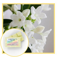 Jasmine and sweet pea wax melts with a close-up of white flowers in the background