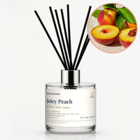 Juicy Peach Reed Diffuser by Seven Scents - glass bottle with halved peaches and green leaves