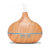 Lucy aromatherapy diffuser natural wood finish with soft LED light glowing