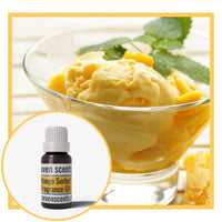 Bowl of mango ice cream with a bottle of Seven Scents Mango Sorbet Fragrance Oil.