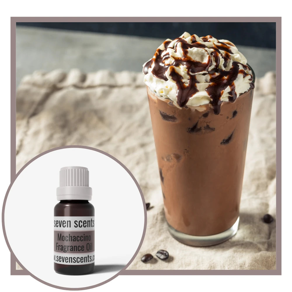 Chocolate drink with whipped cream and a bottle of Seven Scents Mochaccino fragrance oil on a textured surface.