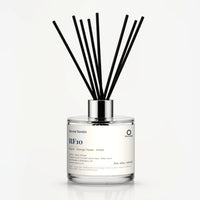 RF10 Reed Diffuser by Seven Scents - 200ml clear glass bottle with black reeds and a silver collar