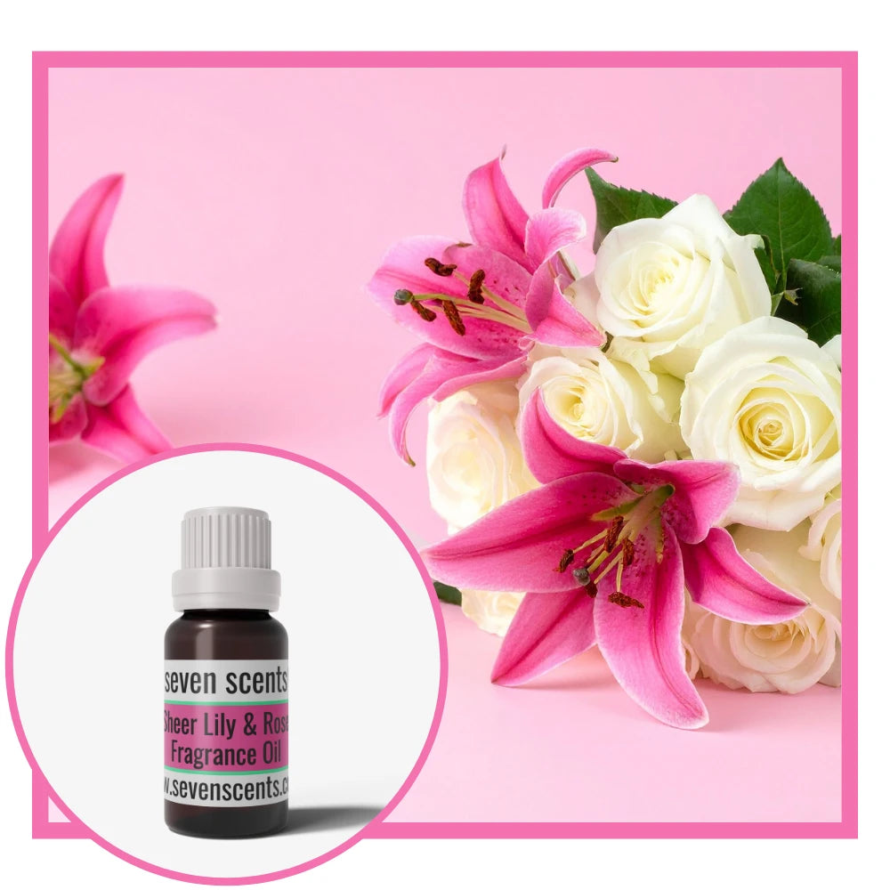 Bouquet of pink lilies and white roses with a Seven Scents sheer lily and rose fragrance oil bottle inset on a pink background.