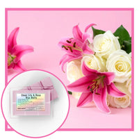 Sheer Lily & Rose wax melts packaging with pink and white flowers on a pink background