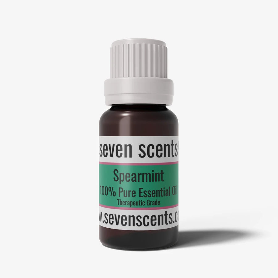 Spearmint essential oil bottle by Seven Scents with a white cap on a white background