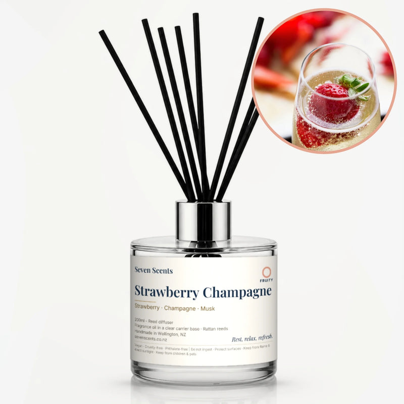 Strawberry and Champagne Reed Diffuser by Seven Scents - glass bottle with a strawberry in a glass of champagne