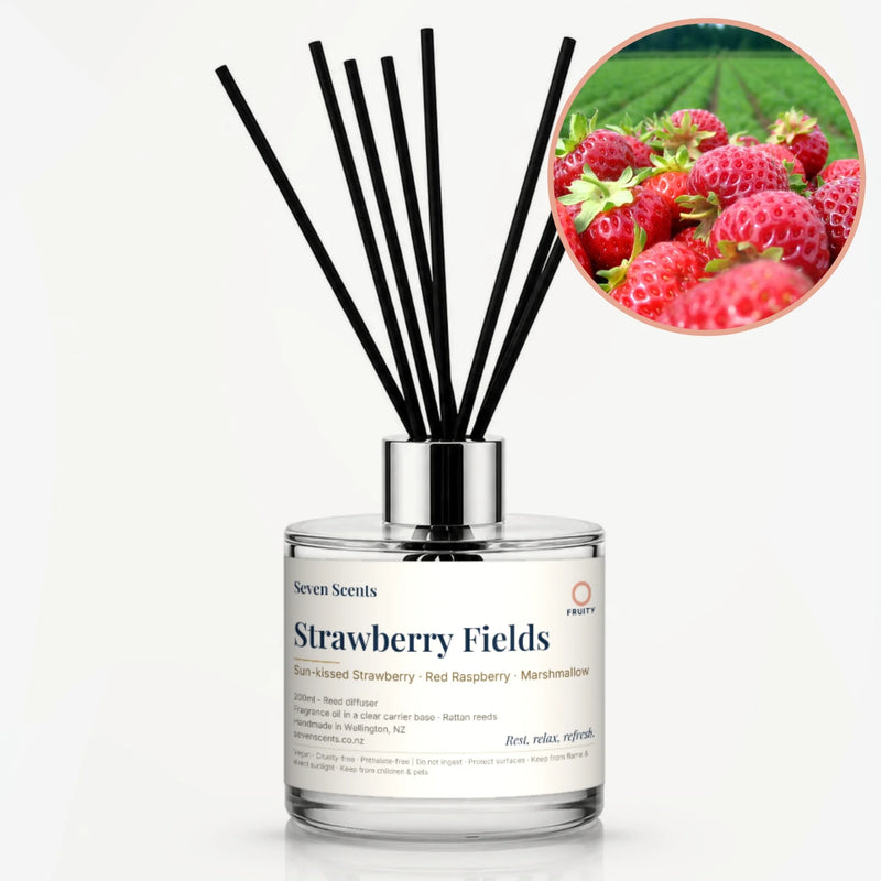 Strawberry Fields Reed Diffuser by Seven Scents - glass bottle with fresh strawberries by a strawberry field