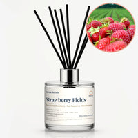 Strawberry Fields Reed Diffuser by Seven Scents - glass bottle with fresh strawberries by a strawberry field