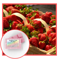 Basket of strawberries with a close-up of Strawberry Fields Wax Melts packaging.