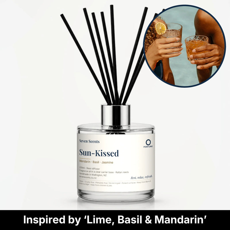 Sun-Kissed Reed Diffuser by Seven Scents - glass bottle with two people clinking drinks by the sea